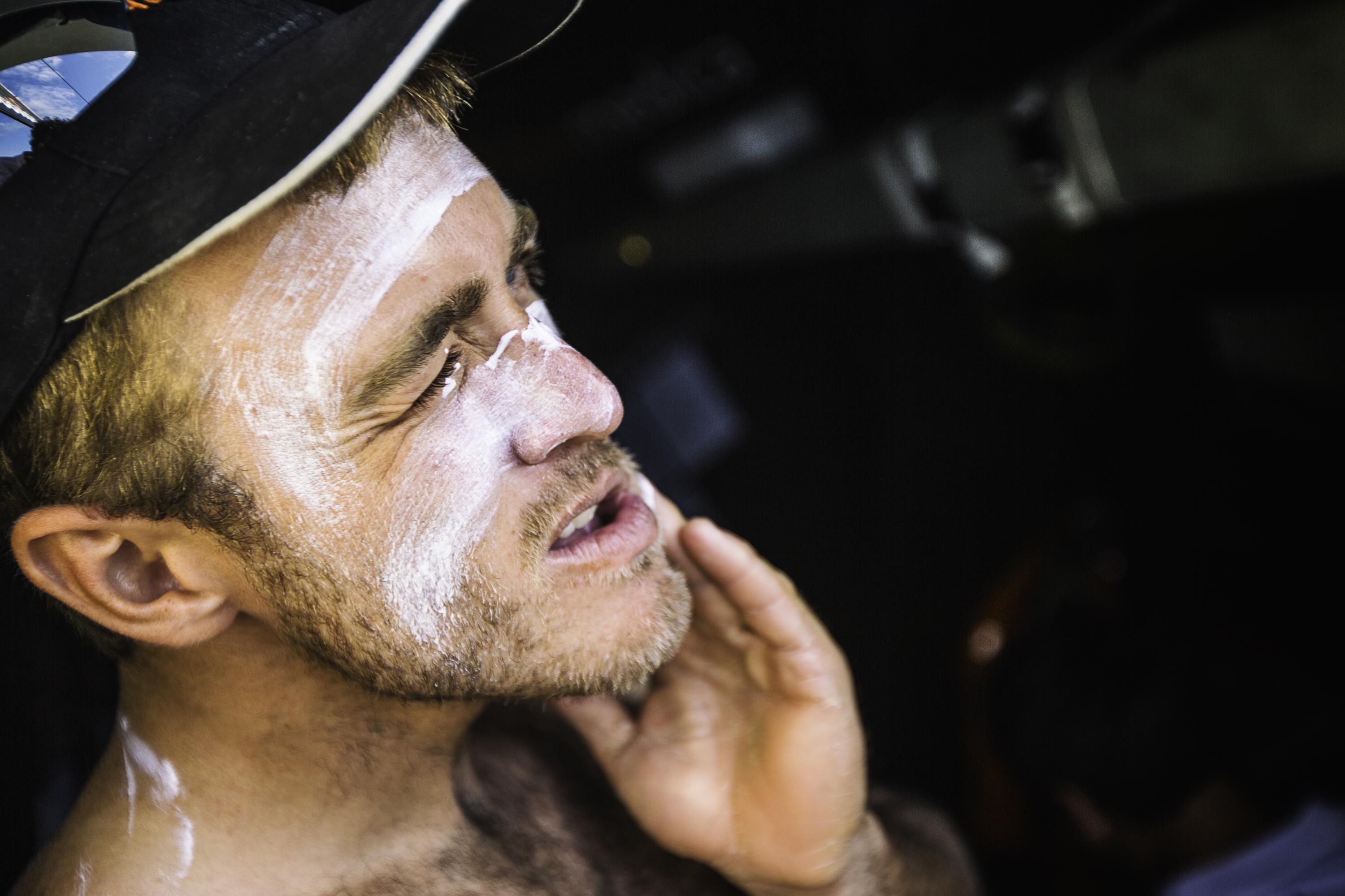 In this handout image provided by the Volvo Ocean Race, onboard Team Alvimedica. Nick Dana applying a healthy dose of sunscreen to protect his face from the intense sun of the tropics during Leg 6 from Itajai to Newport starting on April 19, 2015 in Itajai, Brazil.