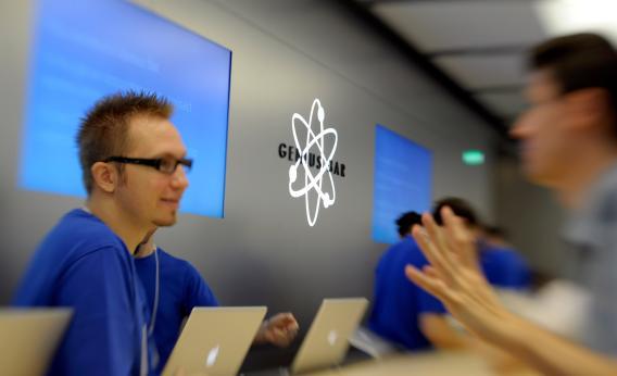 A Genius Bar Reservations Sign at an Apple Store in Front of the Genius Bar  Where Apple Employees are Helping Customers Editorial Stock Image - Image  of global, iphone: 237668444