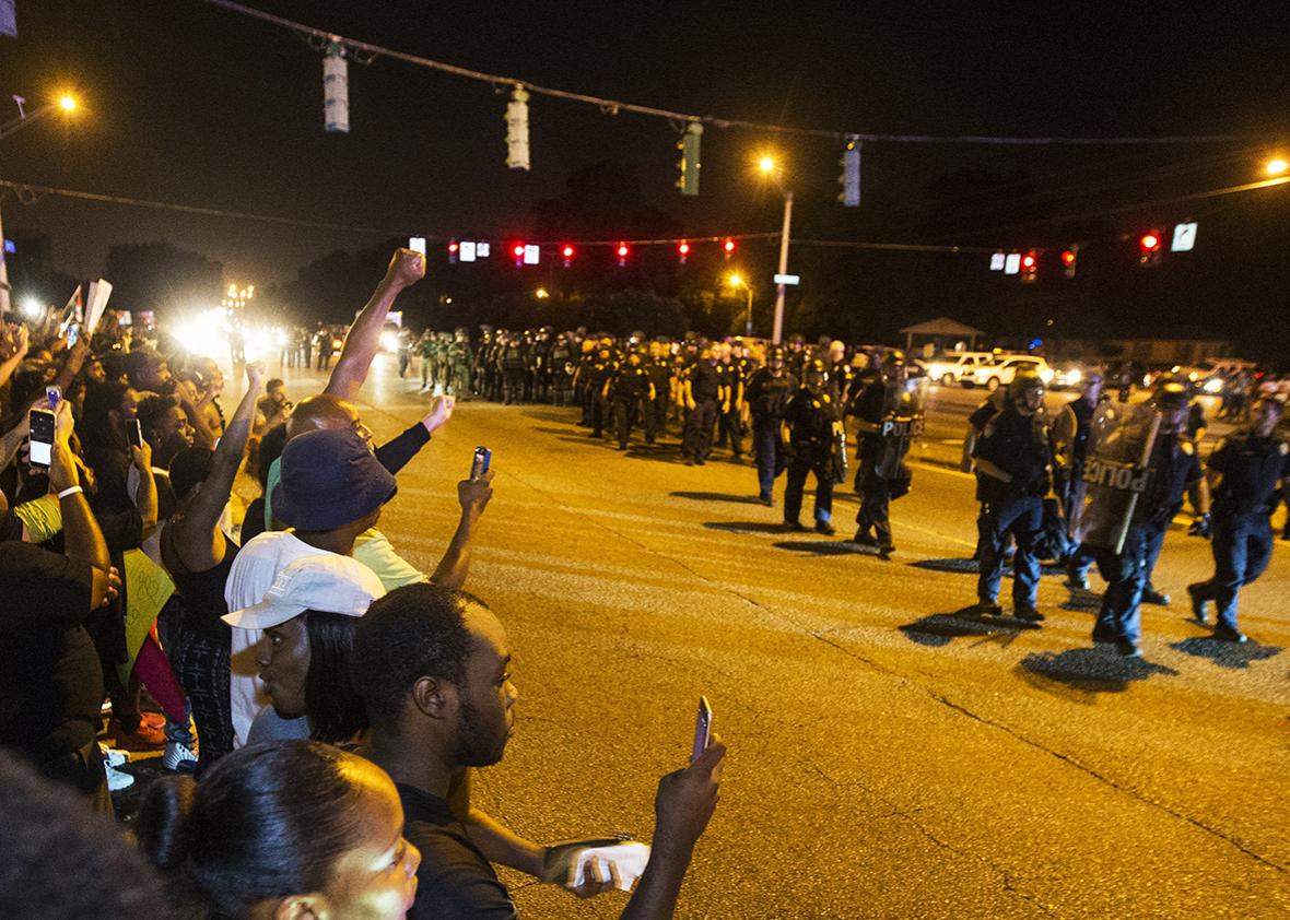 Baton Rouge police in riot gear move in on protesters for a second night in a row on July 9, 2016 in Baton Rouge, Louisiana. 