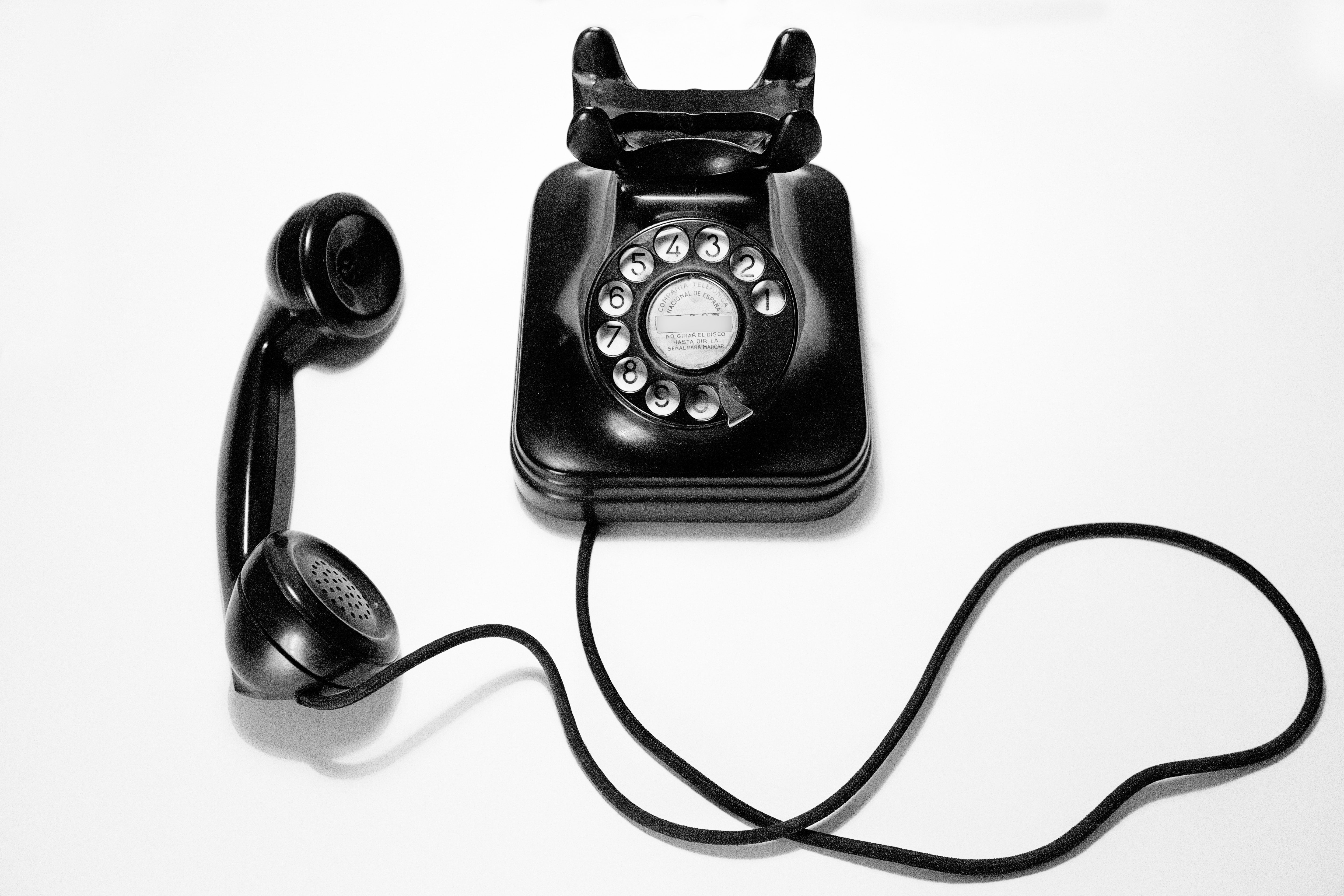 A black rotary phone