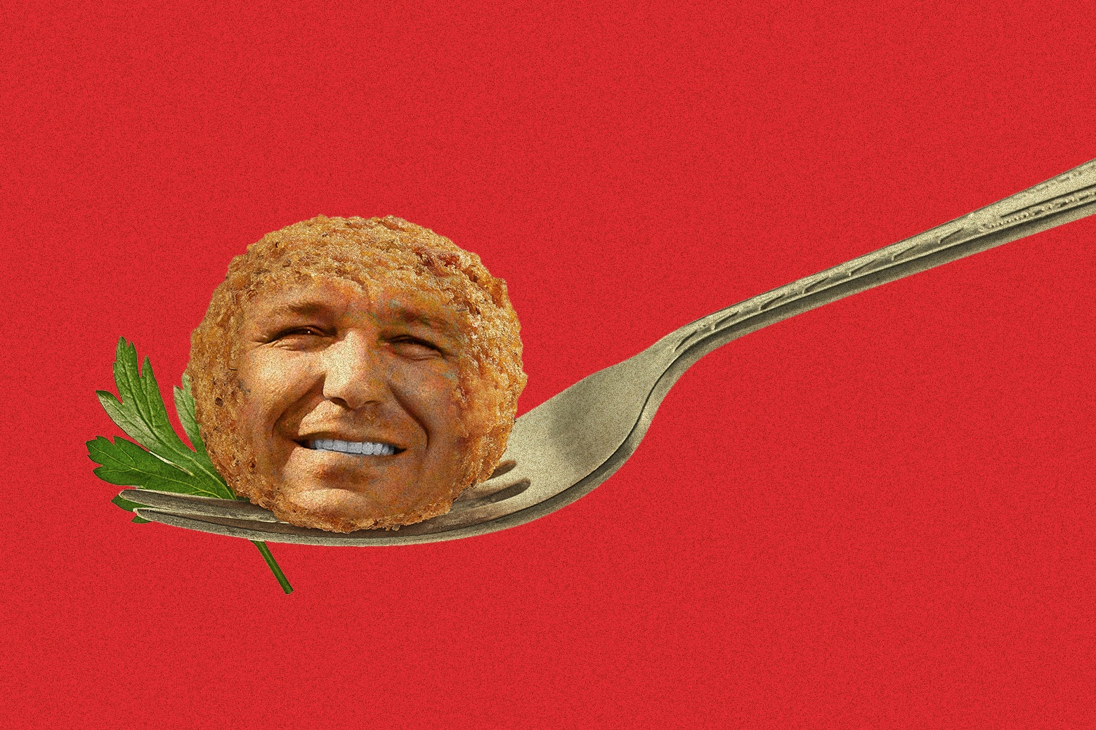 A fork holds a piece of parsley and a meatball with Ron DeSantis's face on it.