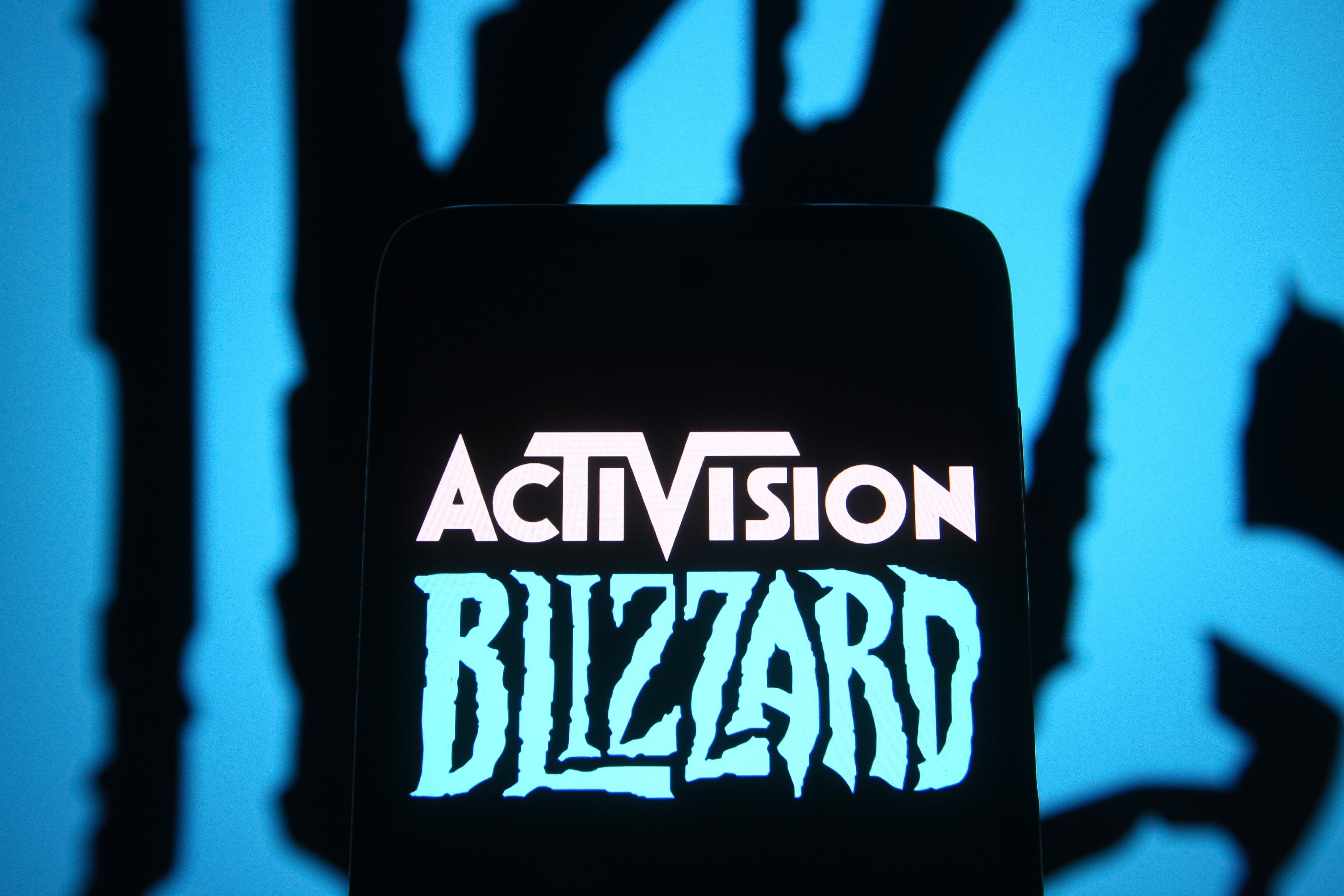 The Activision Blizzard logo, against a blue and black background.