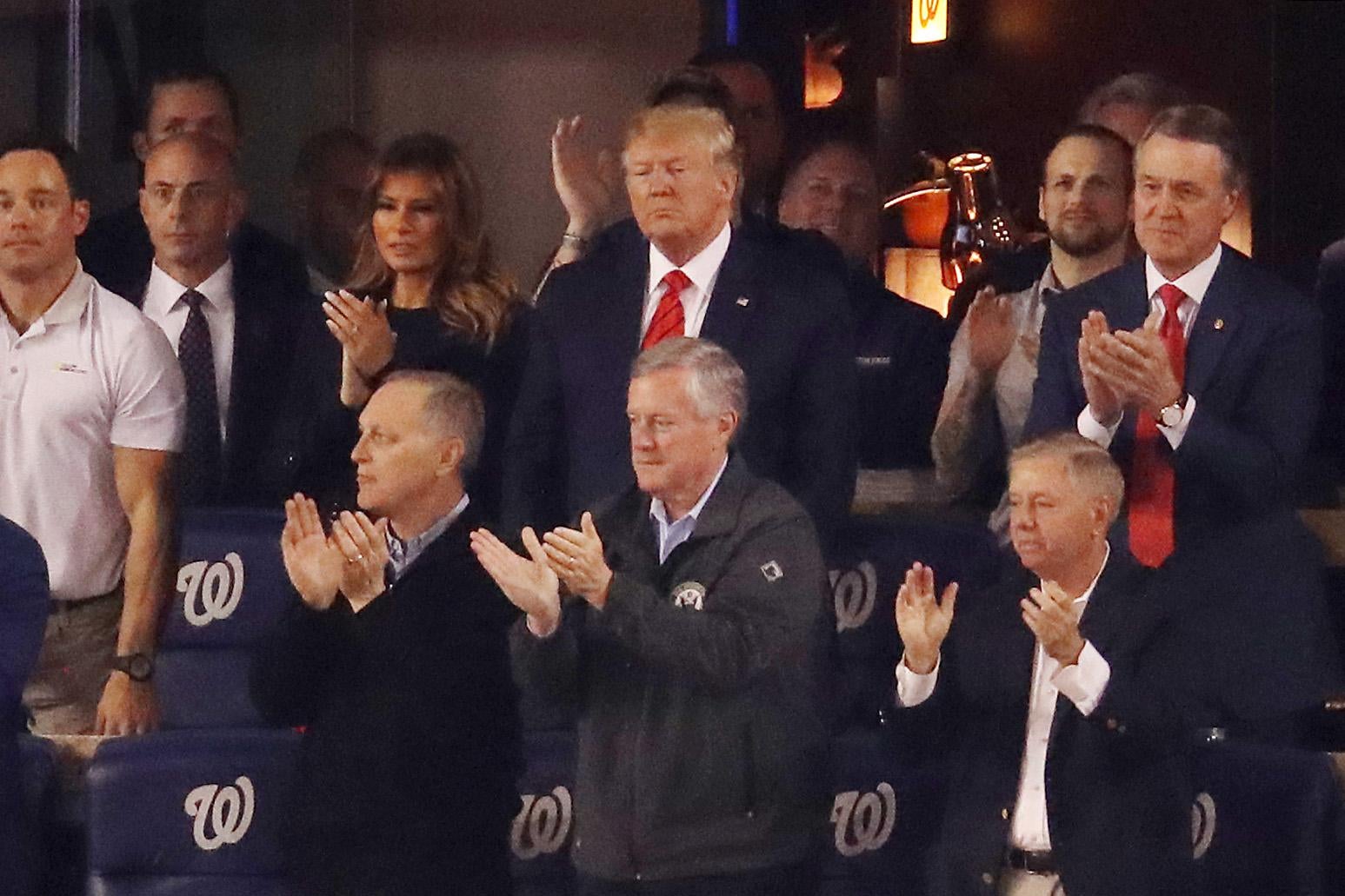 Donald Trump, Melania Trump, Lindsey Graham, and others clapping during Game Five of the 2019 World Series at Nationals Park in Washington on Oct. 27.