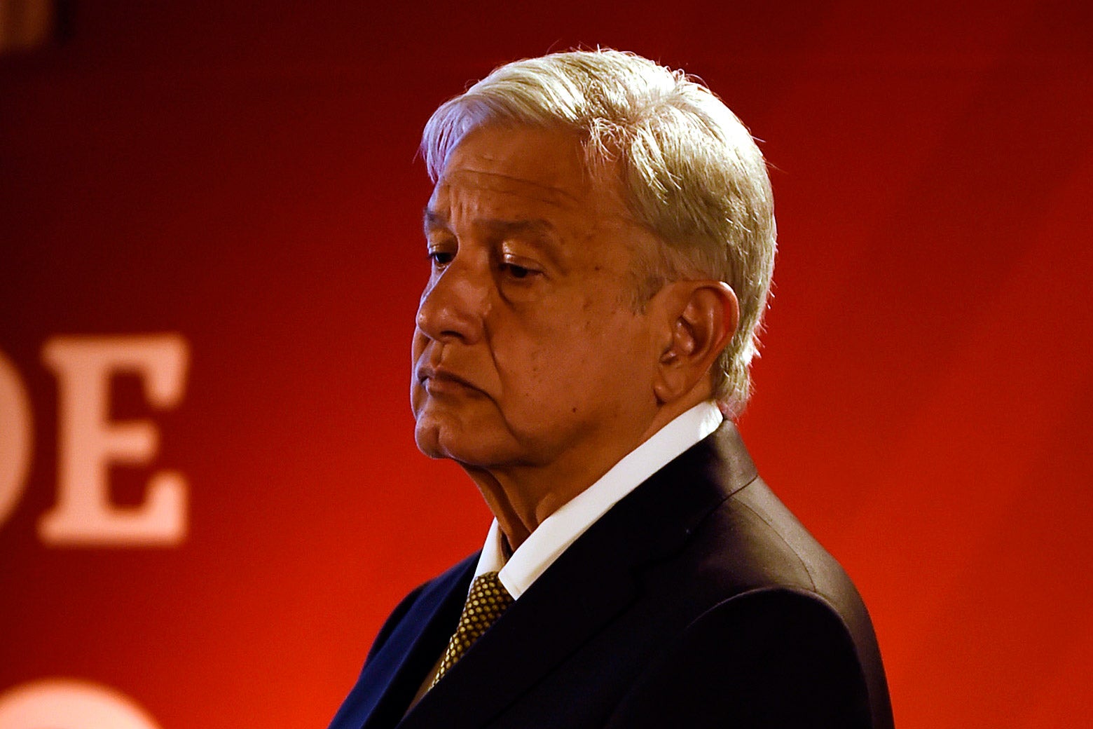 Andrés Manuel Lopéz Obrador looks down.