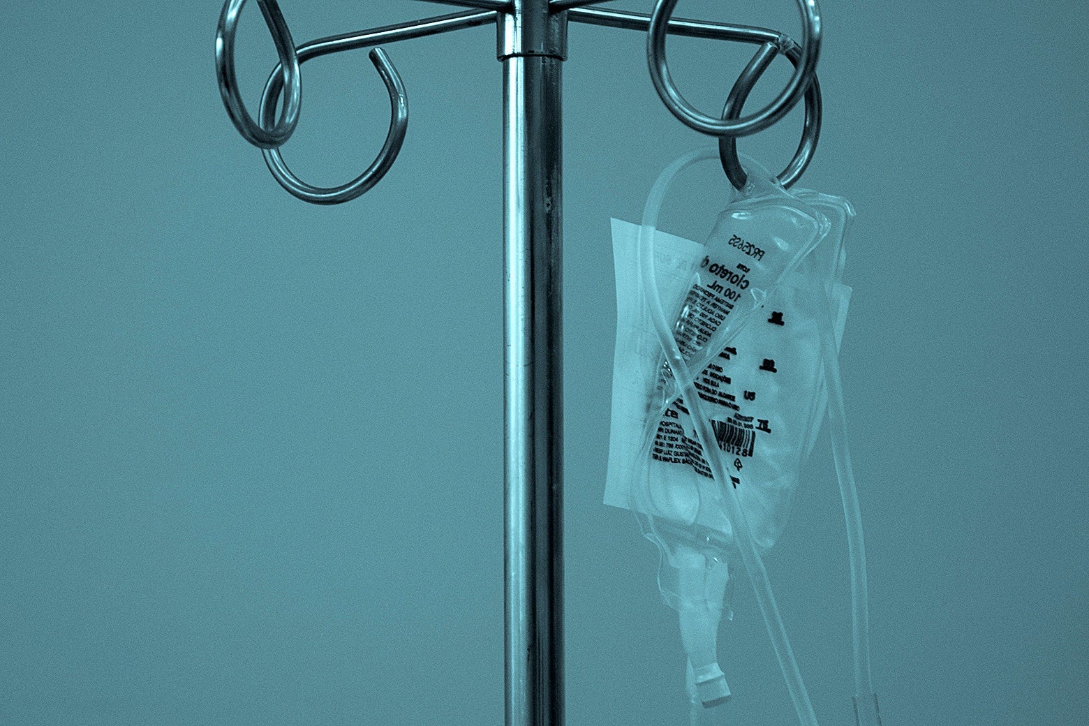 A IV bag hanging on a rack.