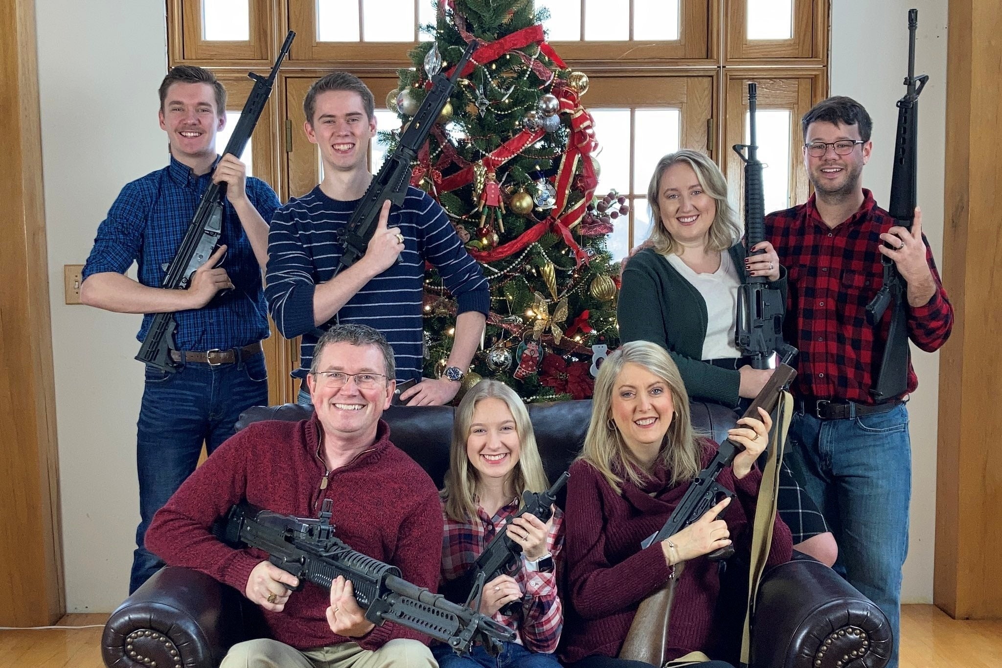 Rep. Thomas Massie (R-KY) is seen in a Christmas photo of his family holding guns in this image obtained from Twitter that was posted on December 4, 2021. 