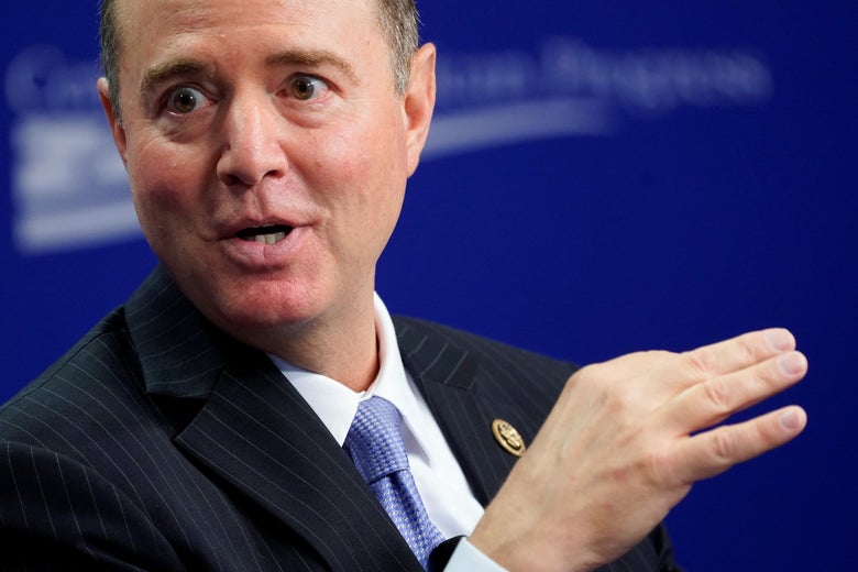 Schiff gestures with one hand as he speaks onstage