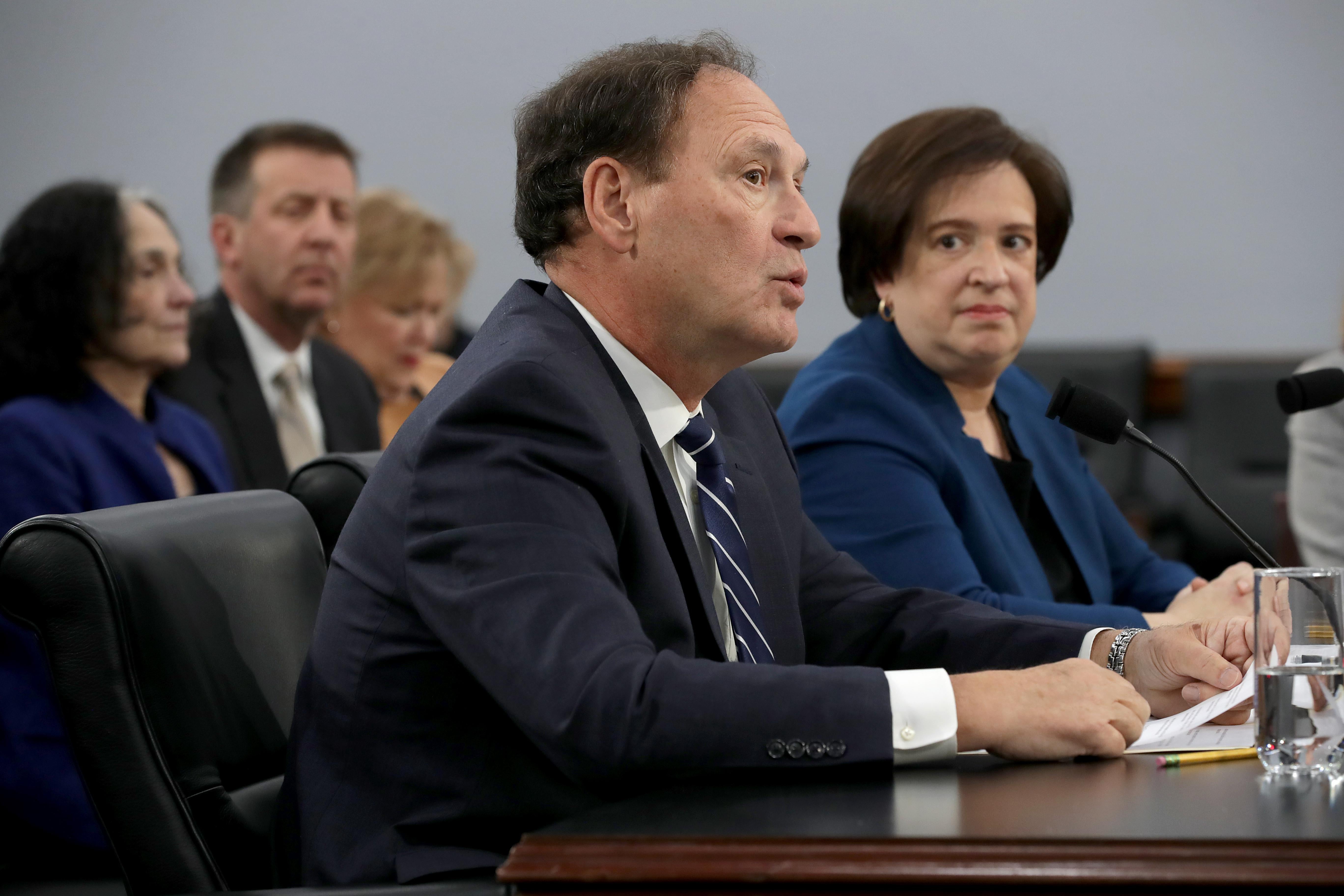 Kagan stares at Alito with a kind of side eye, just like in her Brnovich opinion.