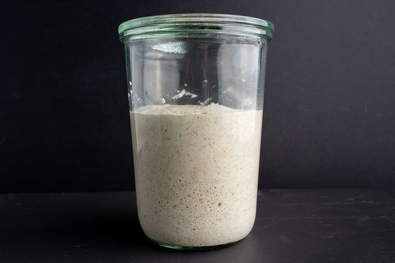 Sourdough starter in a transparent jar.