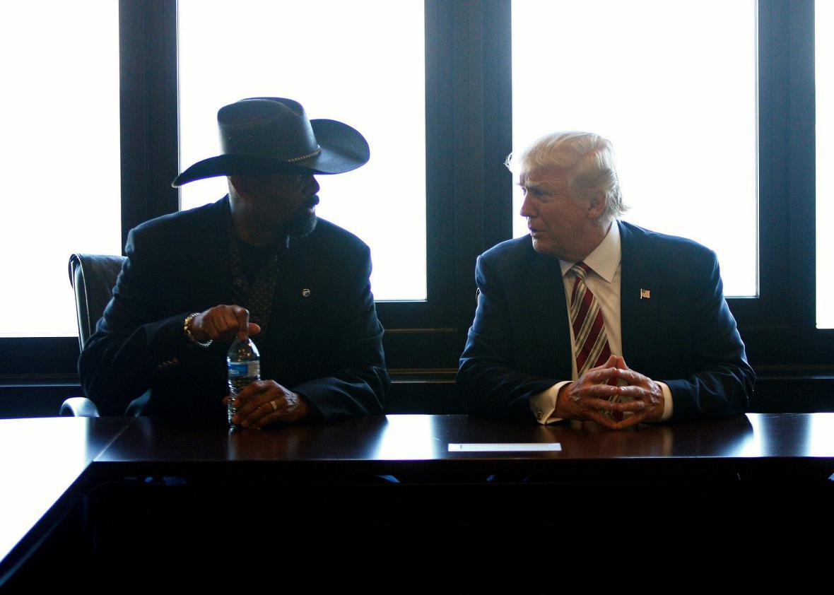 Republican U.S. presidential nominee Donald Trump talks with Milwaukee County Sheriff David Clarke Jr.