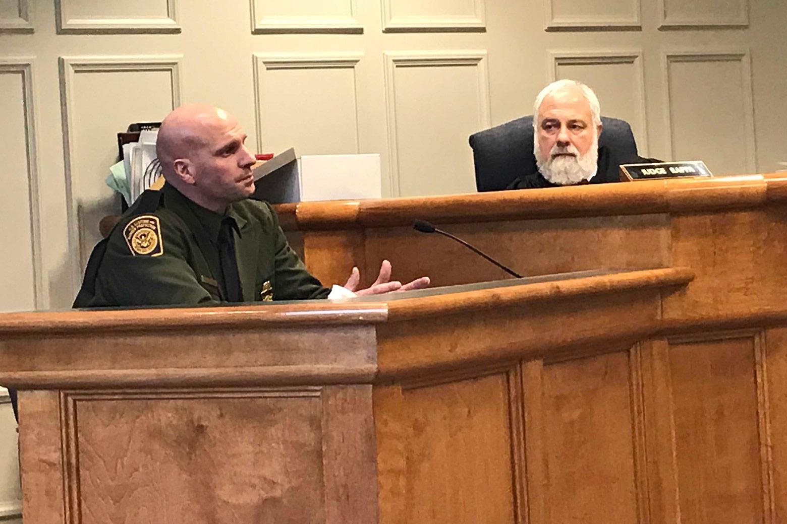 Customs and Border Protection Officer Mark Qualter testifies in Plymouth District Court as Judge Thomas Rappa looks on.  Photo by Mark Joseph Stern.