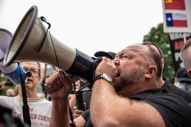 AUSTIN, TX - APRIL 18: Infowars founder Alex Jones speaks into a bullhorn at the Texas State Capital building on April 18, 2020 in Austin, Texas. The protest was organized by Infowars host Owen Shroyer who is joining other protesters across the country in taking to the streets to call for the country to be opened up despite the risk of the COVID-19. (Photo by Sergio Flores/Getty Images)