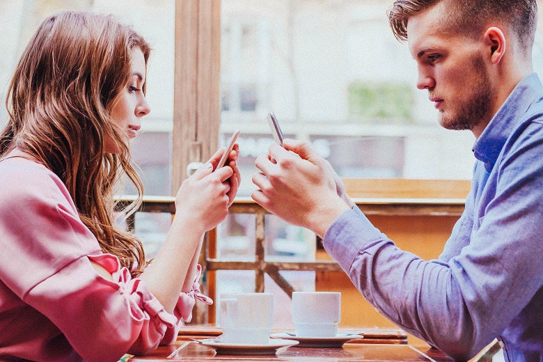 two people on their phones