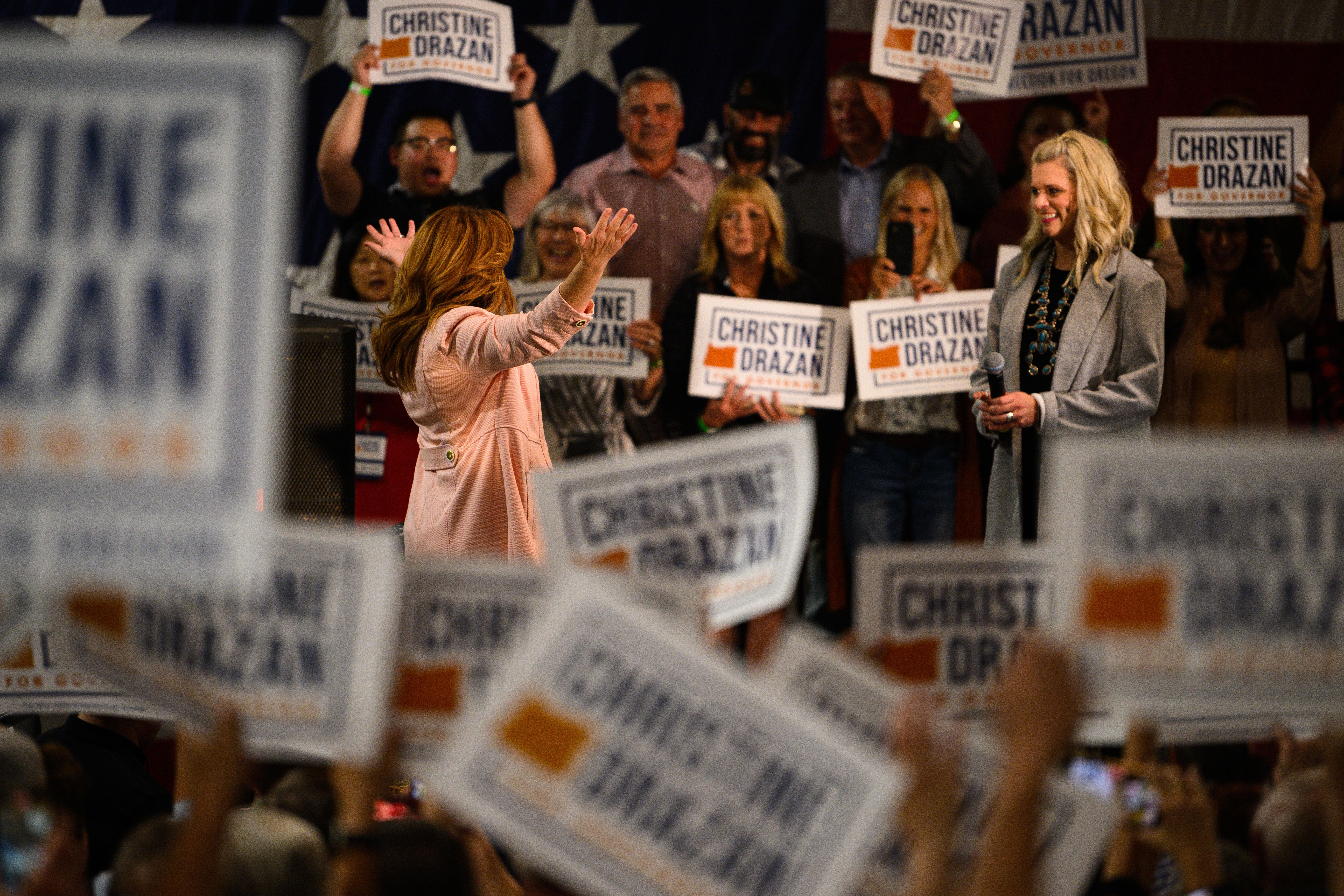 Oregon Republican gubernatorial candidate Christine Drazan stands in a crowd during a rally 