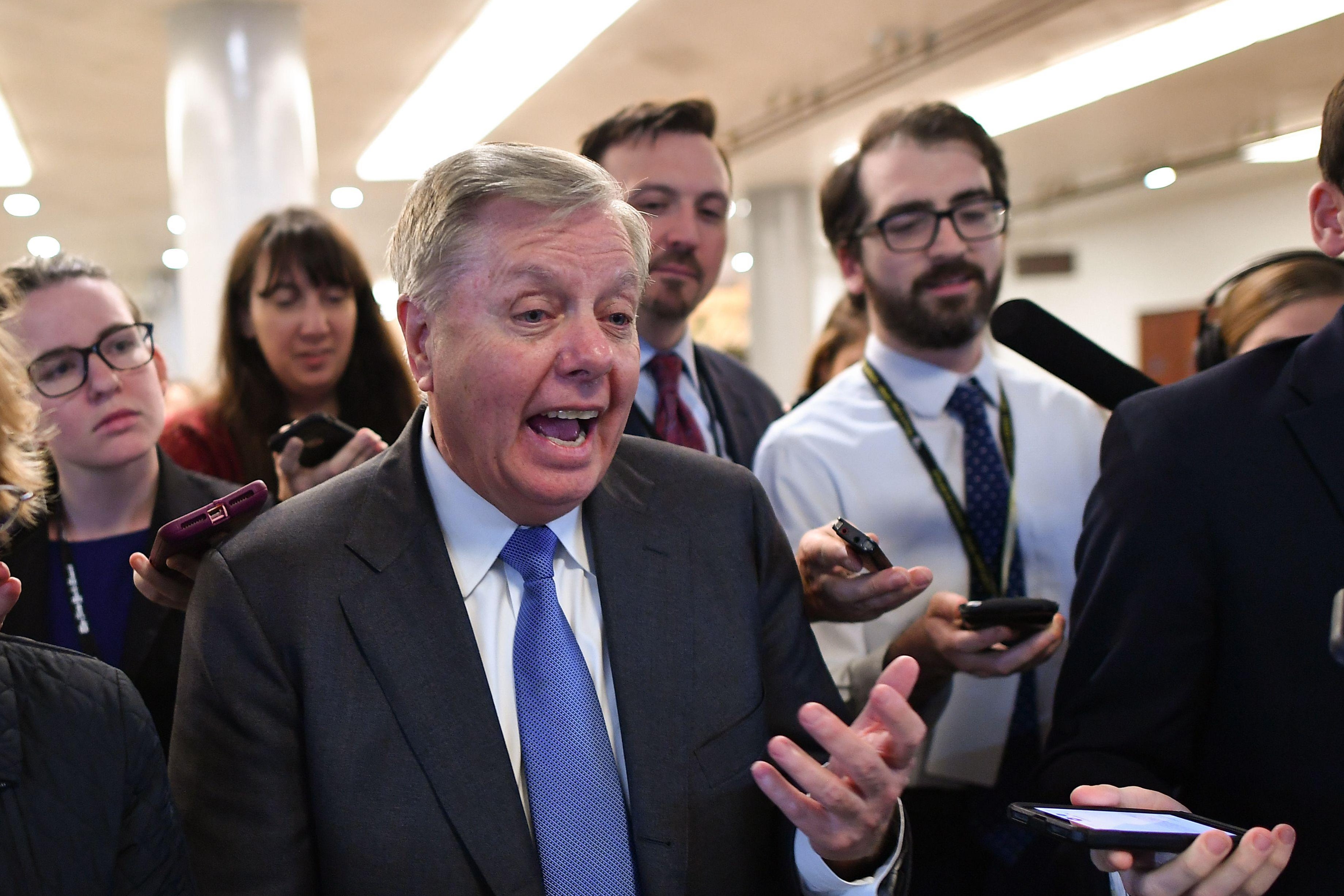 Sen. Lindsey Graham speaks to the media as he leaves after voting in the impeachment trial of the president on Capitol Hill January 31, 2020, in Washington, DC.