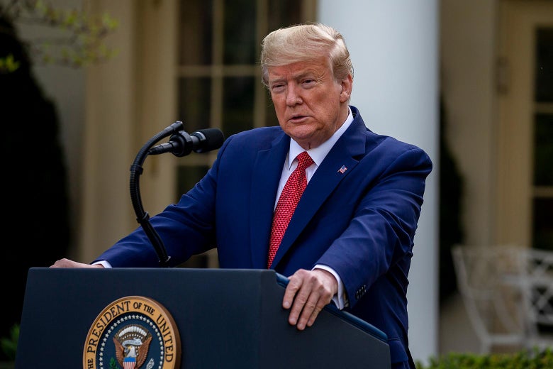 Donald Trump at a podium outside the White House.