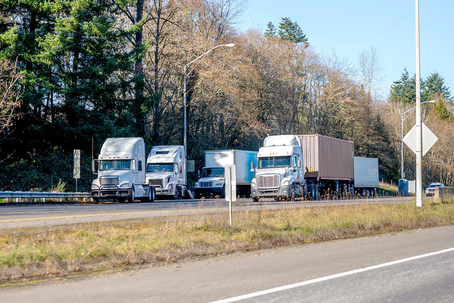 Trucks parked on a highway.