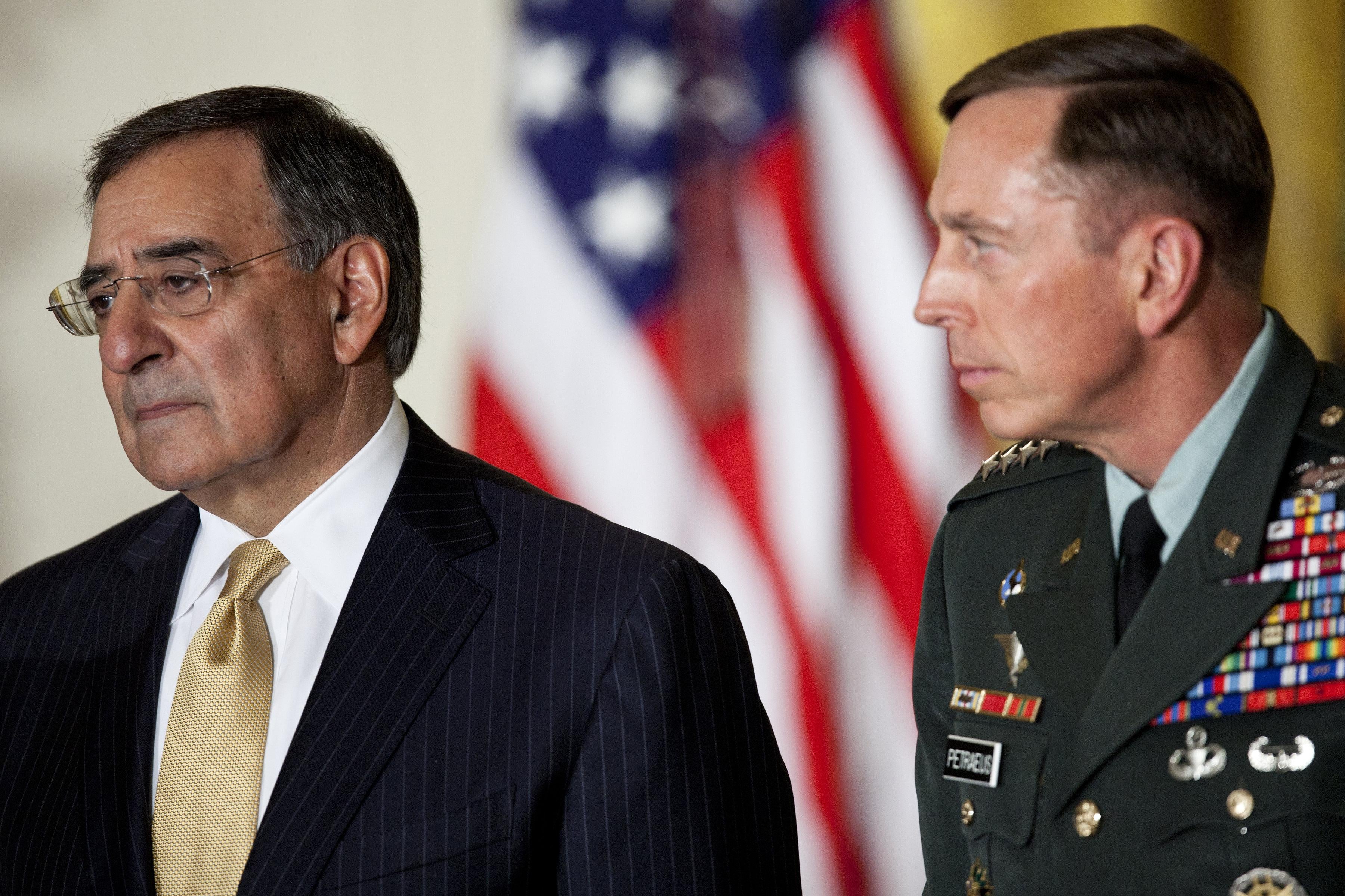 Then director of the Central Intelligence Agency Leon Panetta and Gen. David Petraeus listen during an event in the East Room of the White House.