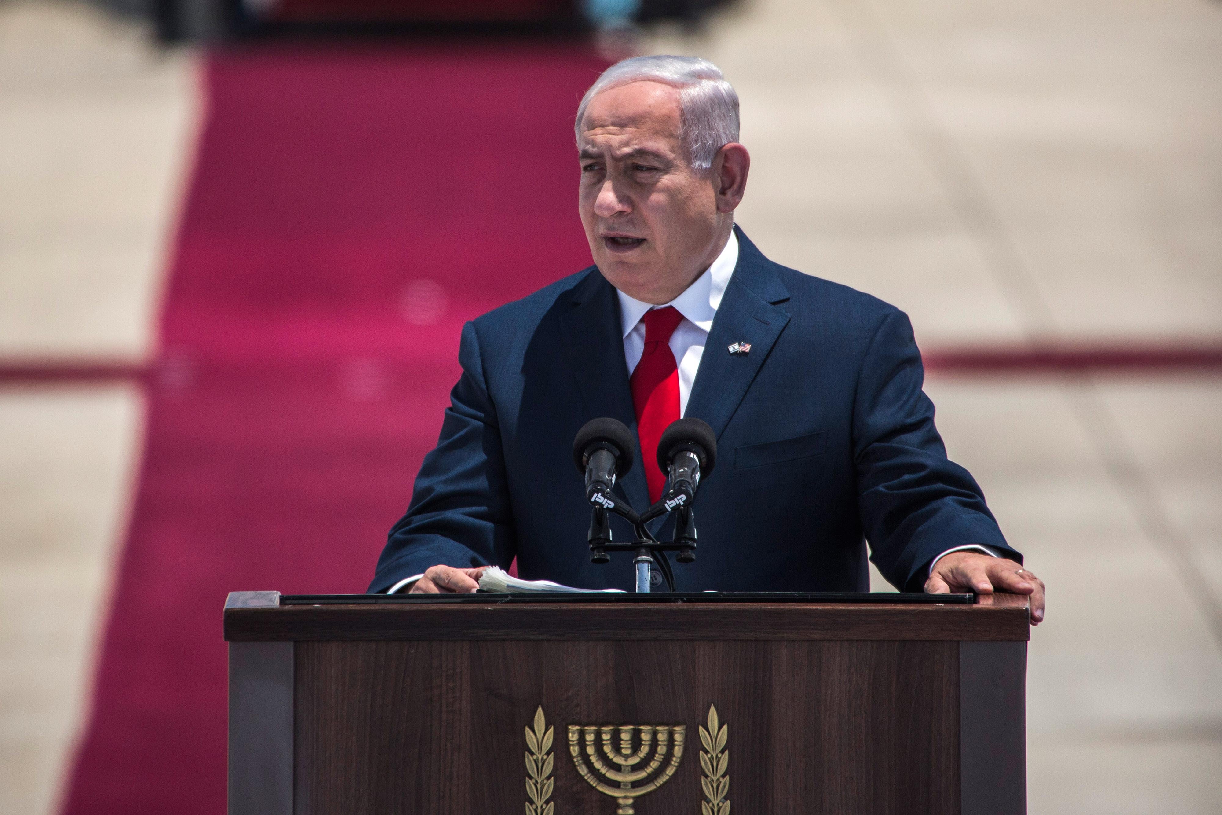 TEL AVIV, ISRAEL - MAY 22:   Israeli Prime Minister Benjamin Netanyahu gives a welcoming speach during an official welcoming ceremony on US Presidents Trump arrival at Ben Gurion International Airport on May 22, 2017 near Tel Aviv, Israel. This will be Trump's first visit as President to the region, and his itinerary will include meetings with the Palestinian and Israeli leaders. (Photo by Ilia Yefimovich/Getty Images)