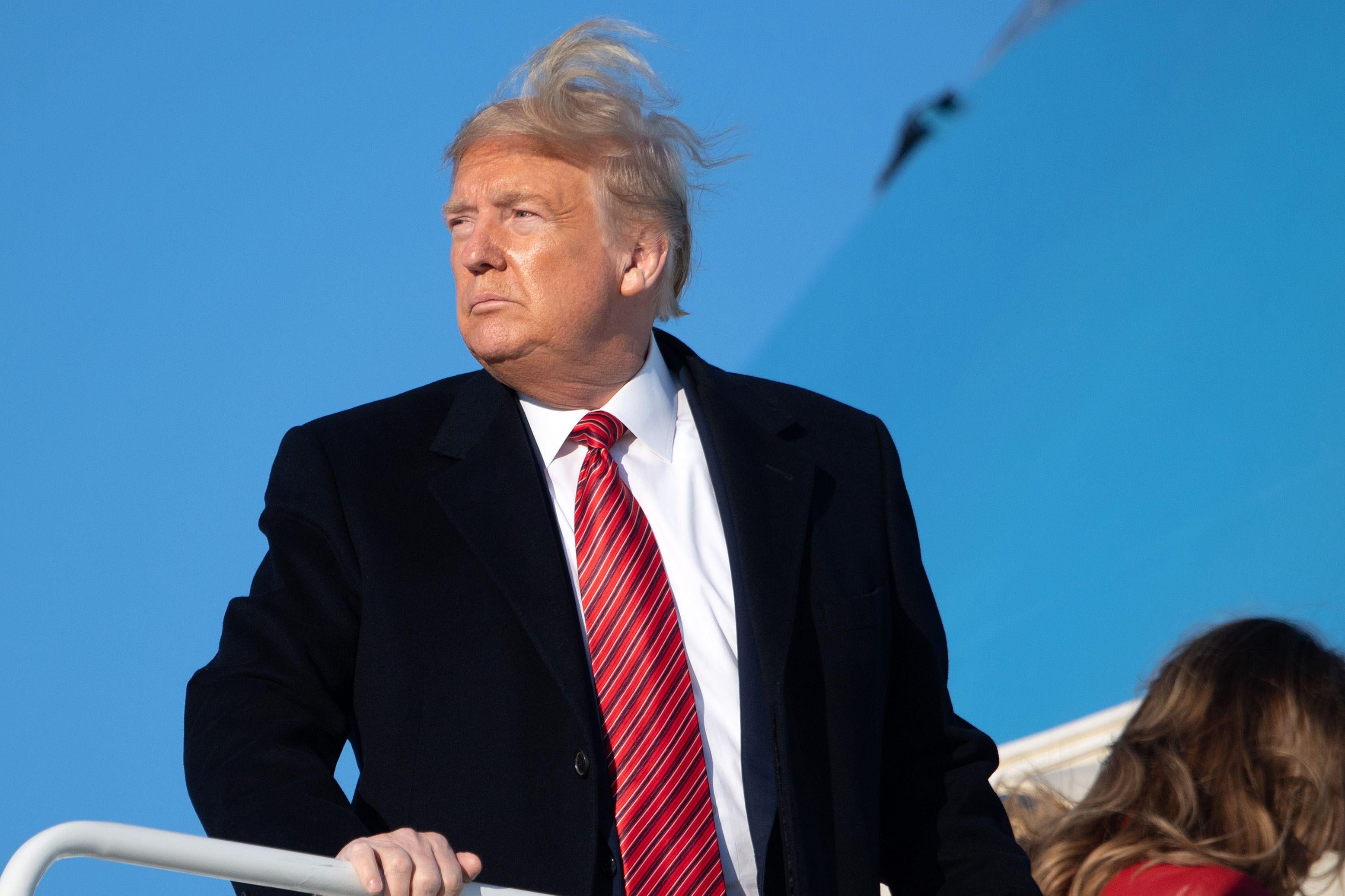 US President Donald Trump and First Lady Melania Trump board Air Force One prior to departure from Joint Base Andrews in Maryland, February 14, 2020, as they travels to Mar-a-lago in Florida for the weekend. (Photo by SAUL LOEB / AFP) (Photo by SAUL LOEB/AFP via Getty Images)