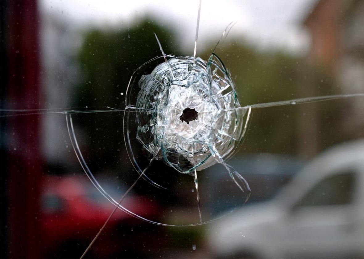 Bullet shot through window of home.