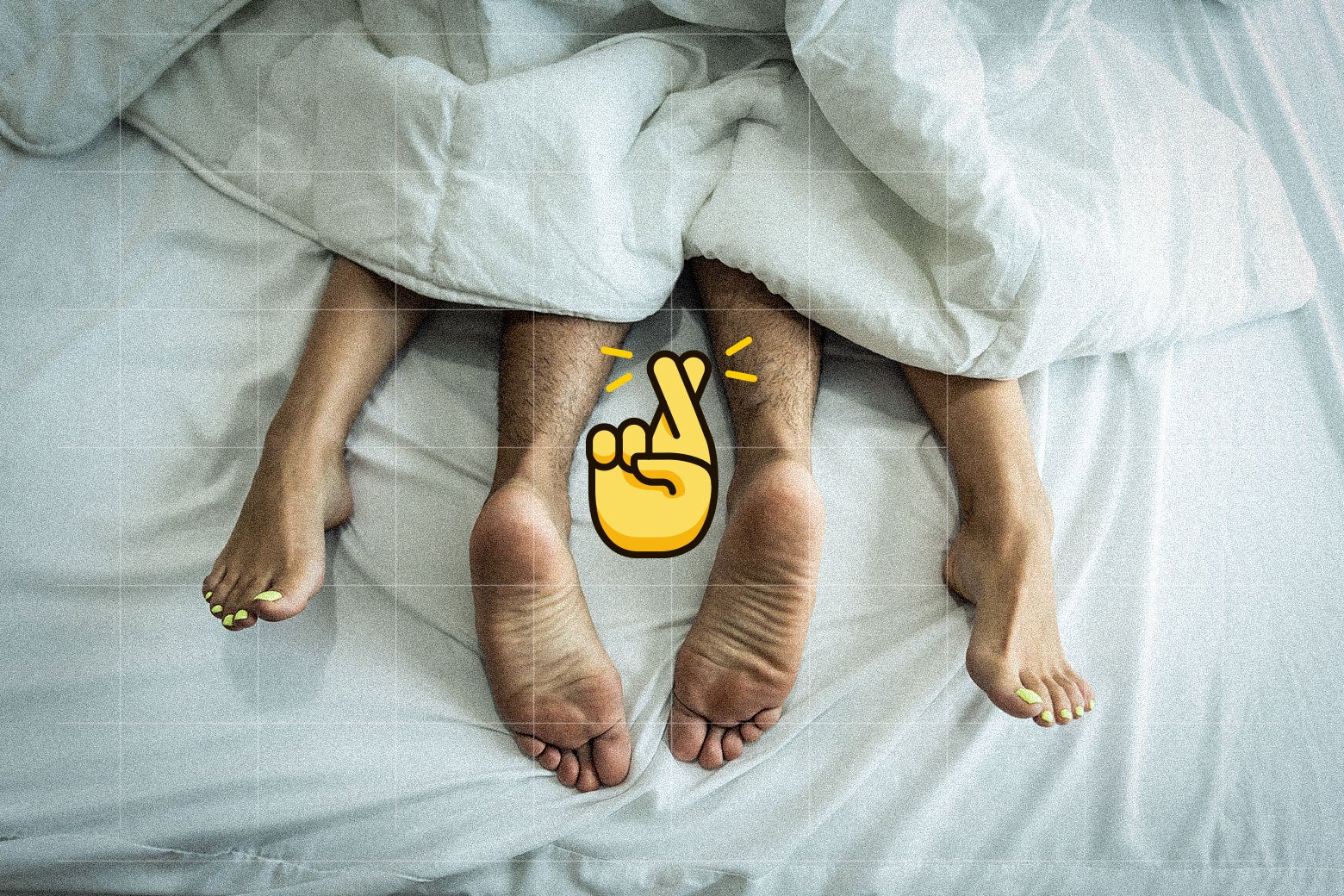 On a bed and under sheets, the feet of a couple who are having sex. On top of this image is the crossed-fingers emoji.