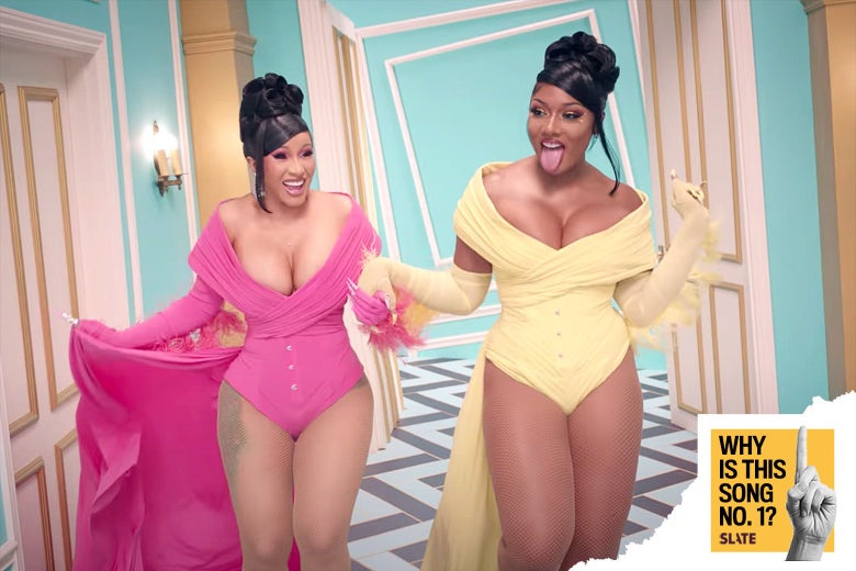 Cardi B and Megan Thee Stallion in the "WAP" video, with sign reading "Why Is This Song No. 1" and featuring a pointed index finger.