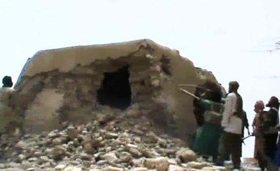 A still from a video shows Islamist militants destroying an ancient shrine in Timbuktu.