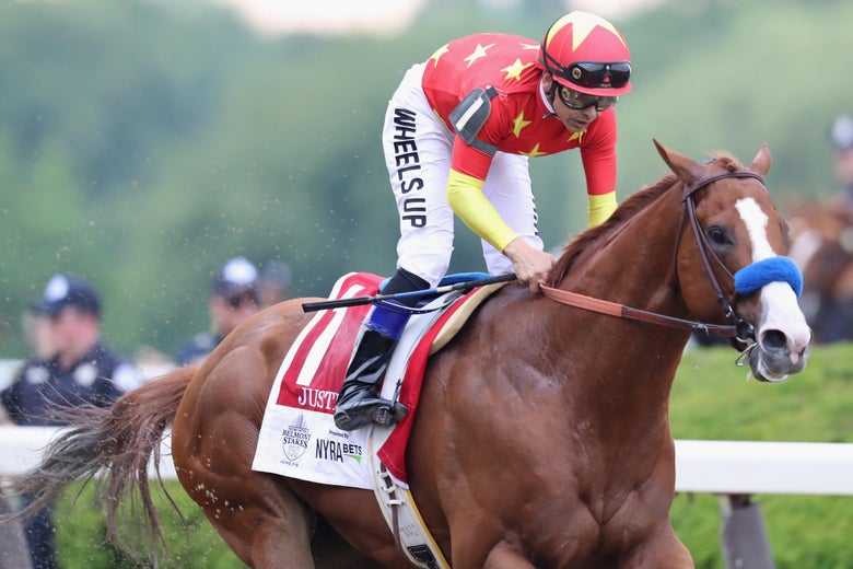 Justify, ridden by Mike Smith, running the Belmont Stakes.