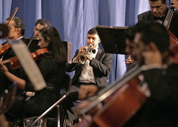Members of Iraq's National Symphony Orchestra (INSO) perform during a concert at the National Theatre in Baghdad October 28, 2011.