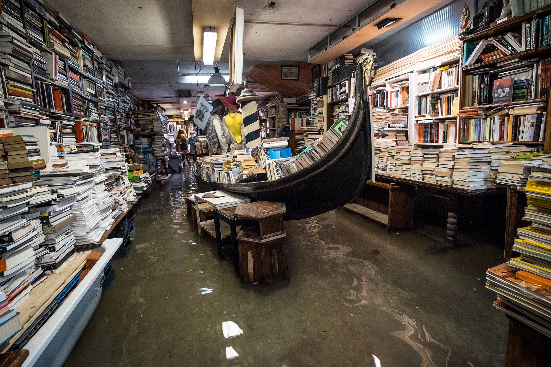 Water inside the historic Venice bookshop 'Libreria Acqua Alta'.