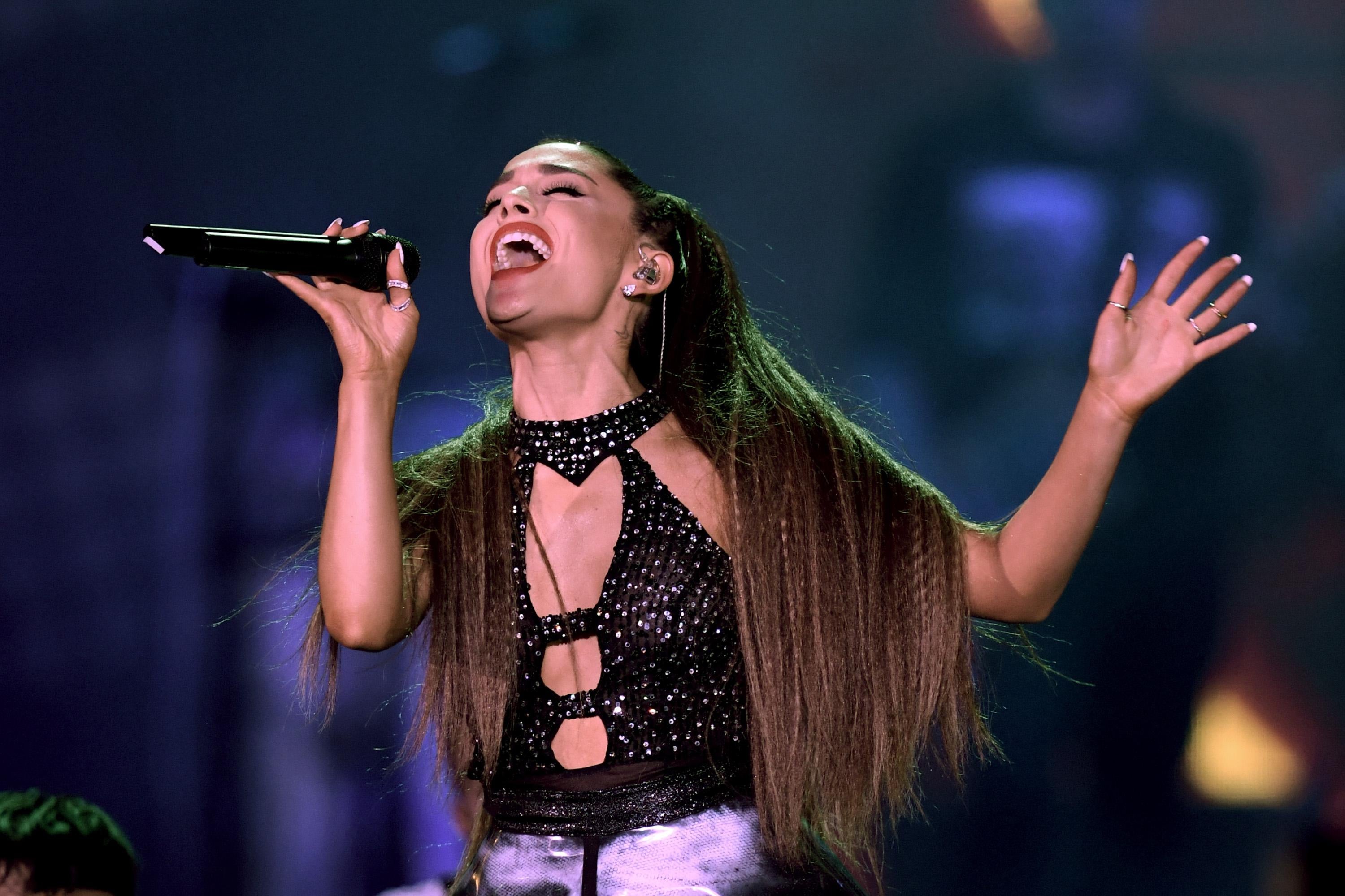 Ariana Grande singing.