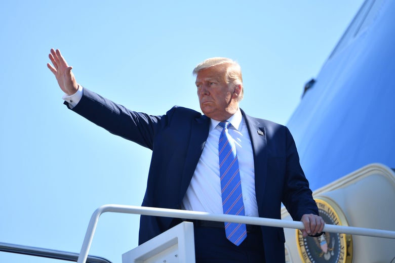 Trump waving while boarding Air Force One