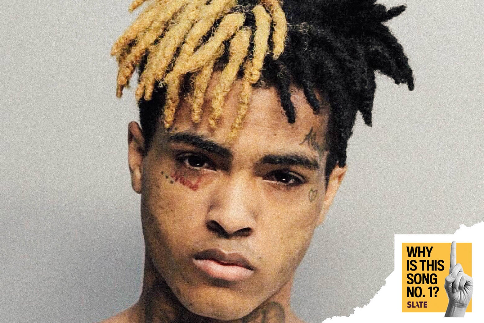 A mug shot of XXXTentacion with the Why Is This Song No. 1? logo.
