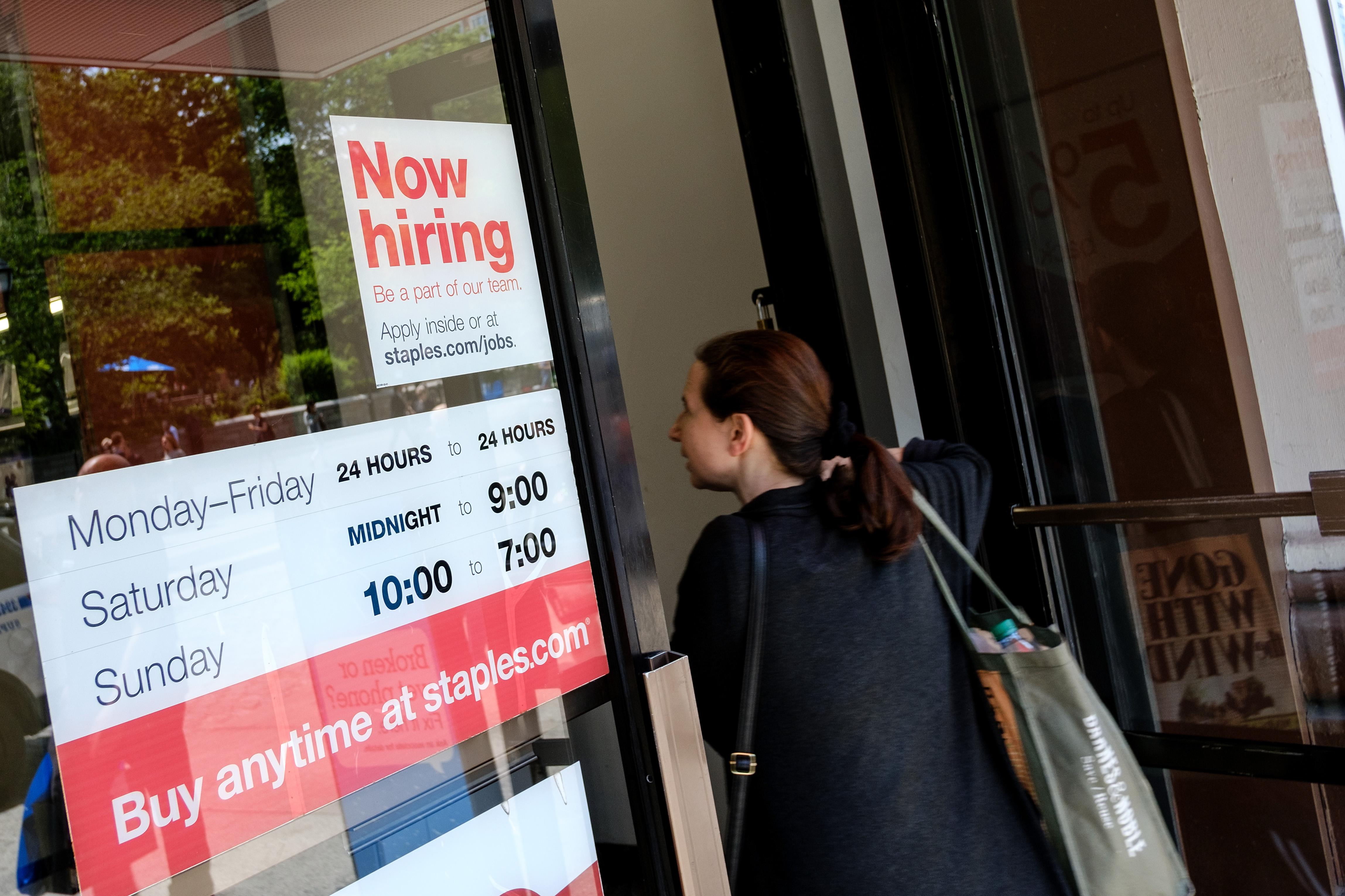 NEW YORK, NY - JUNE 2: A 'now hiring' sign is displayed on the front entrance to a Staples store,  June 2, 2017 in New York City. While U.S. unemployment has hit it lowest level since 2001 at 4.3 percent for May, the U.S. economy added only 138,000 jobs last month and many Americans have stopped looking for work. (Photo by Drew Angerer/Getty Images)