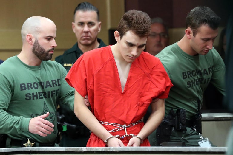 FT. LAUDERDALE, FL - MARCH 14:  Nikolas Cruz is escorted into the courtroom for his arraignment at the Broward County Courthouse in Fort Lauderdale on Wednesday, March 14, 2018. Cruz is accused of opening fire at Marjory Stoneman Douglas High School in Parkland on Feb. 14, killing 17 students and adults. Amy Beth Bennett, South Florida Sun Sentinel, Pool