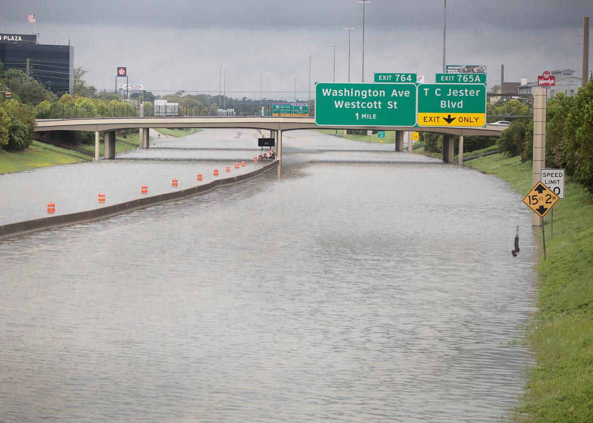 Water flows down Interstate 10 which has been inundated with flooding from Hurricane Harvey on August 27, 2017 in Houston, Texas. 