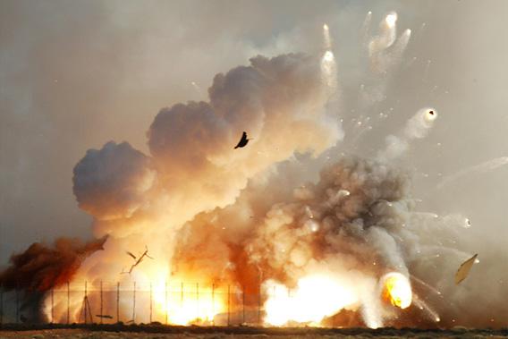 The rocket that carried the next generation supersonic model aircraft explodes on impact after it crashed into the desert at the Woomera rocket range in outback Australia.