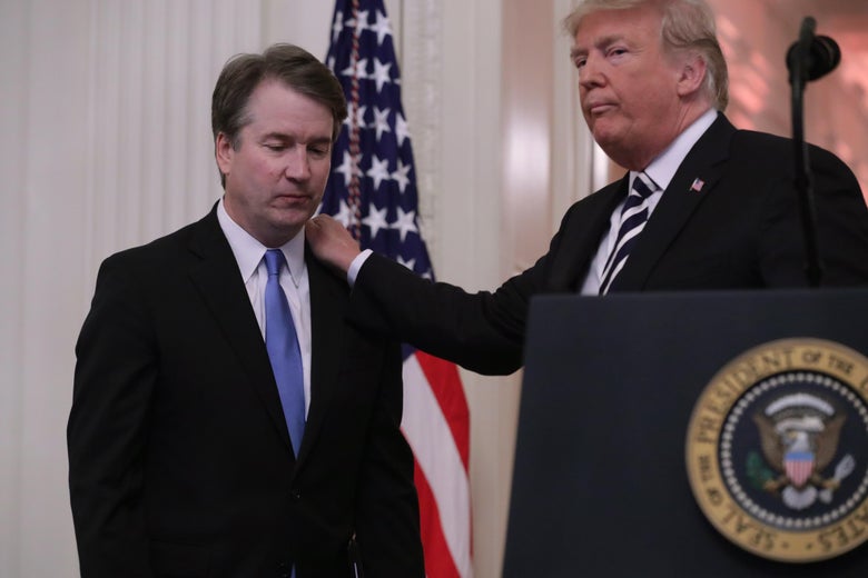 President Donald Trump puts his hand on Supreme Court Associate Justice Brett Kavanaugh's shoulder during his ceremonial swearing in in the East Room of the White House on October 8, 2018 in Washington, D.C.