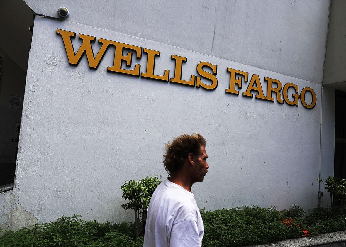 A Wells Fargo sign is seen on the exterior of one of their bank branches on September 9, 2016 in Miami, Florida. 