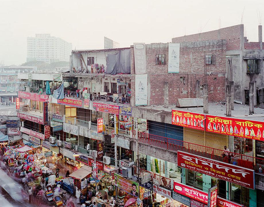 View of homes and businesses in the New Market area of Dhaka, Bangladesh in February, 2013. The area is home to a large street market as well as other shops, small factories and other businesses.