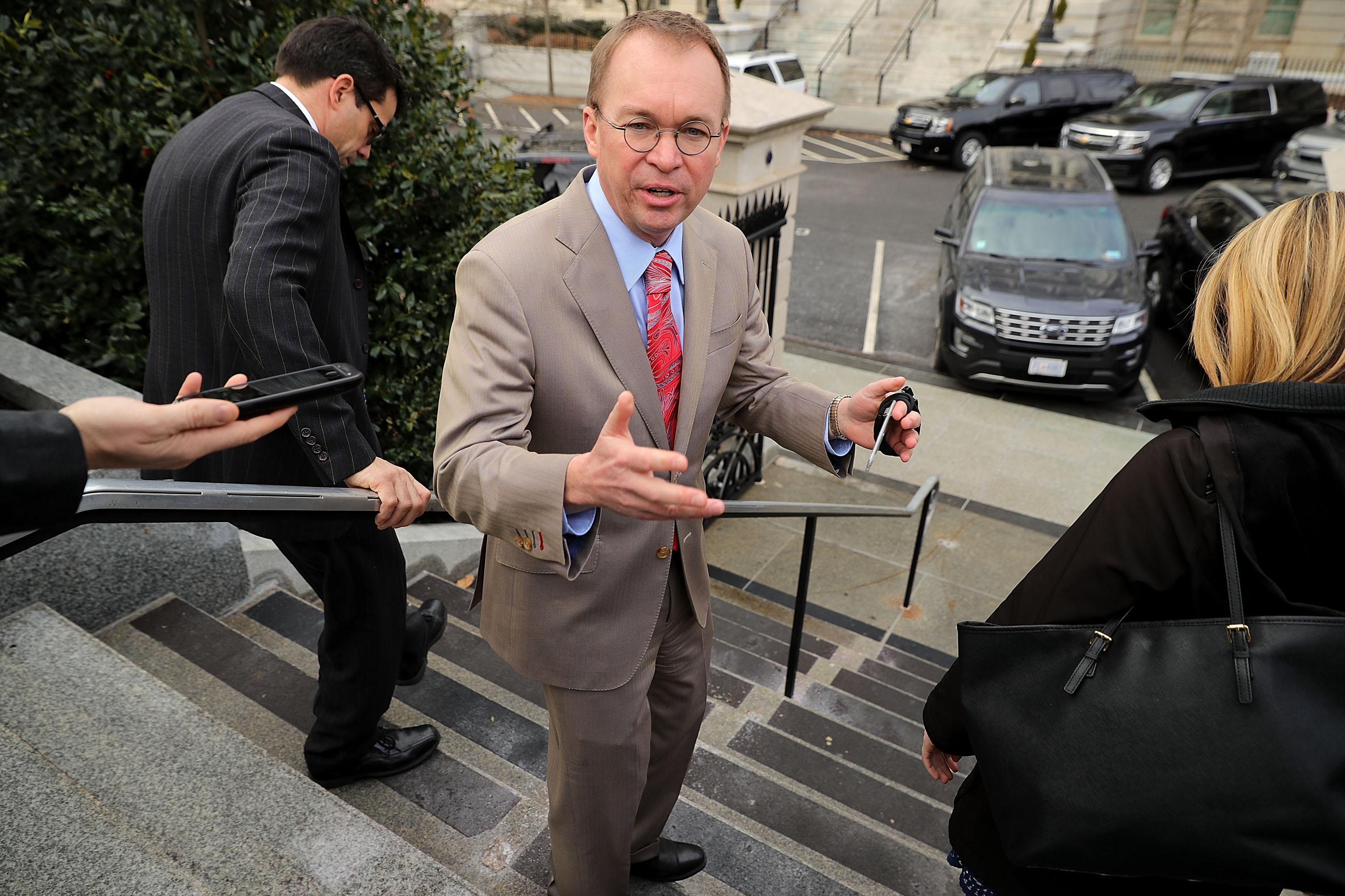 WASHINGTON, DC - JANUARY 22:  Office of Management and Budget Director Mick Mulvaney talks briefly to reporters about the ongoing partial federal government shutdown outside the White House January 22, 2018 in Washington, DC. Lawmakers and the White House continue to negotiate an end to the shutdown with a vote scheduled for noon in the U.S. Senate.  (Photo by Chip Somodevilla/Getty Images)
