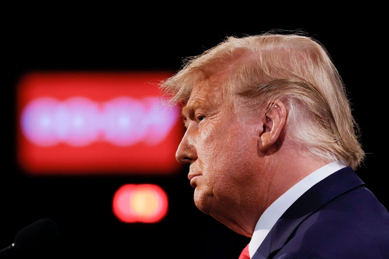 Trump with his yap shut, in profile, with a red clock behind him