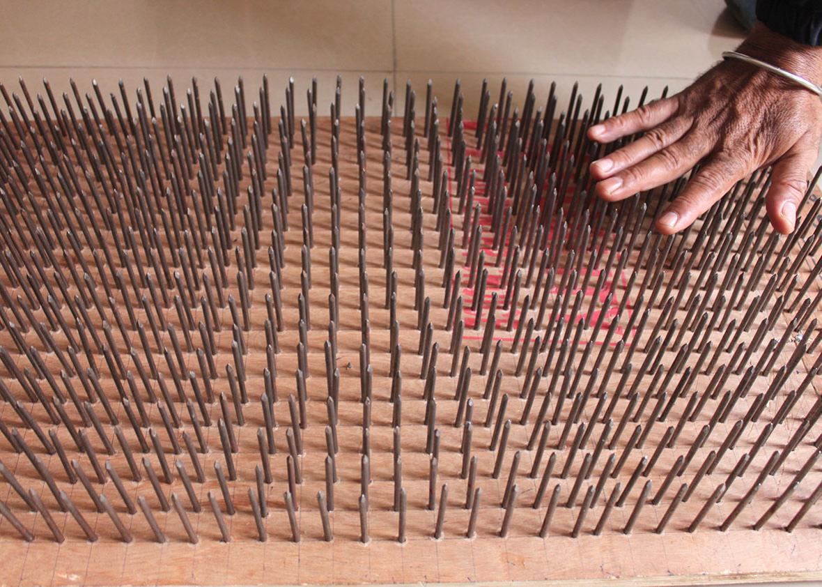 A bed of nails that Manoj can lie down on to demonstrate how to bear pain. It's one of his stunts.