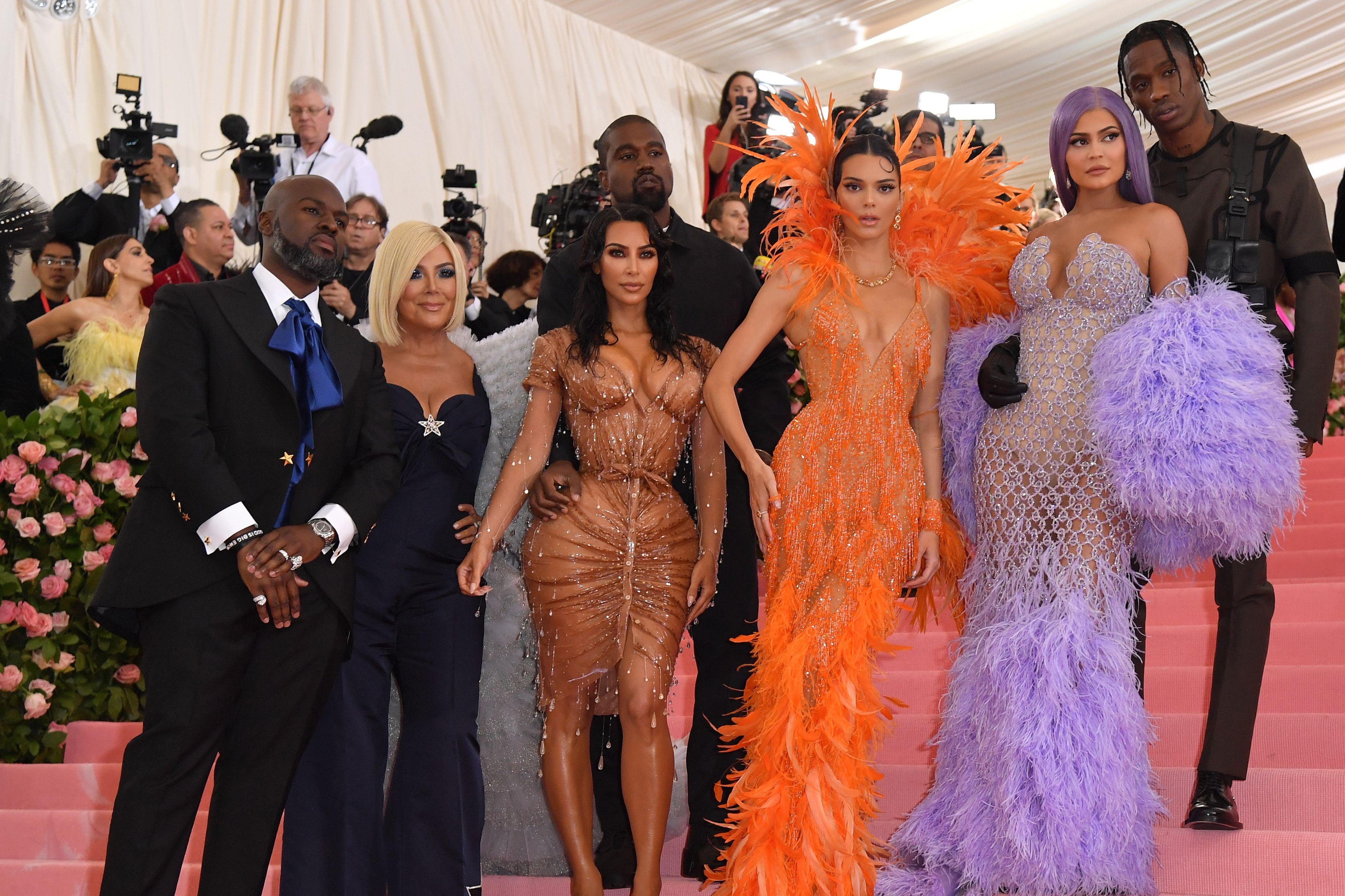Corey Gamble, Kris Jenner, Kanye West, Kim Kardashian West, Kendall Jenner, Kylie Jenner, and Travis Scott on the stairs of the Met.
