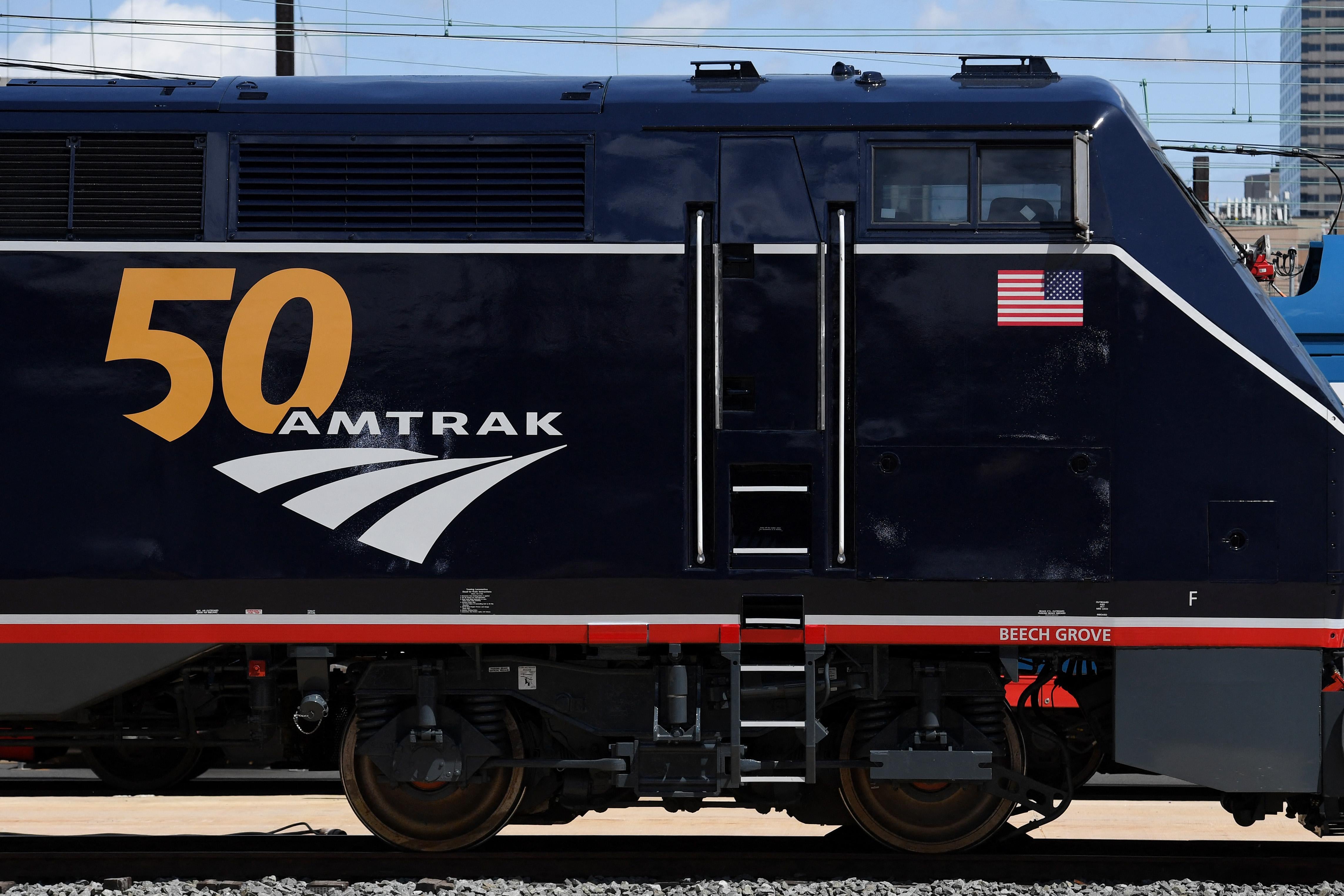 A train that reads "50 Amtrak" on its side. 