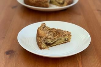 A small slice of cake on a plate.