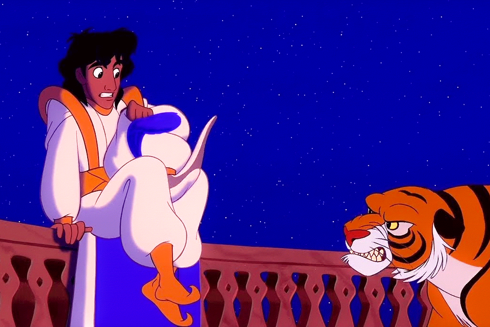 Still from Aladdin with a tiger menacing Aladdin. For a split second, "TAKE OFF YOUR CLOTHES" flashes over the image.