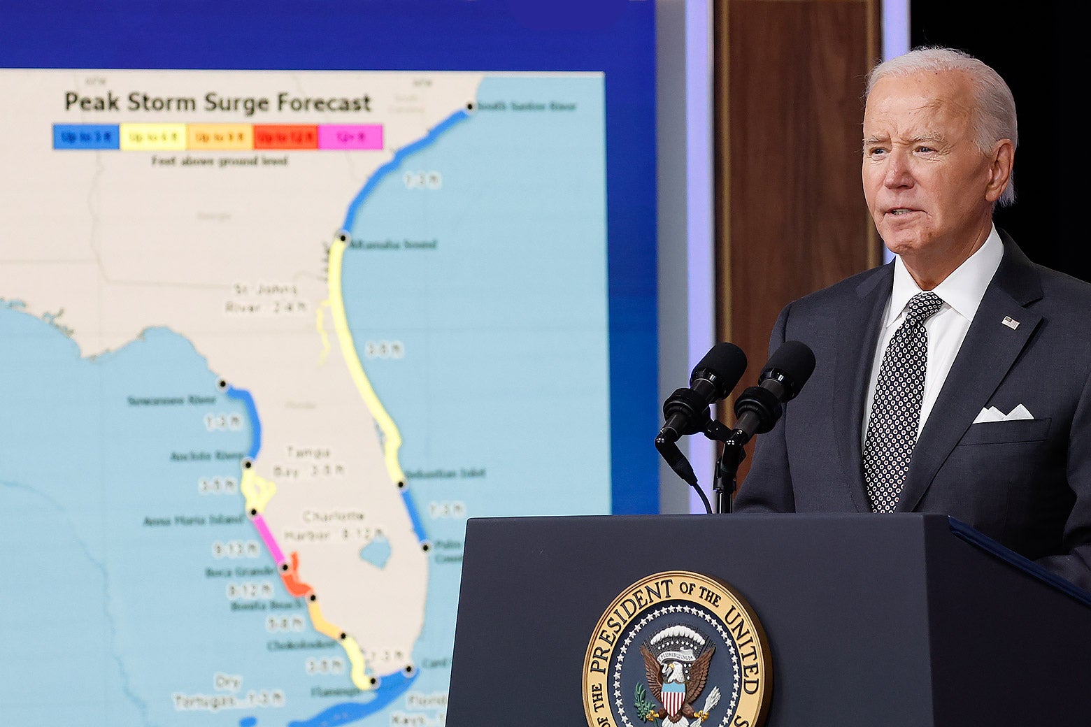 Biden at a podium in front of a map of Florida.