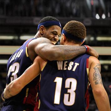 LeBron James celebrates with teammate Delonte West during an NBA game against the Phoenix Suns.